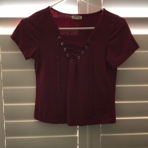 Dark maroon shirt w/ laces in front to tie